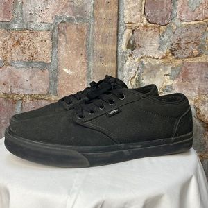 Solid black Vans
